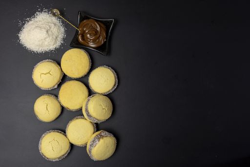 A top view of alfajor with coconut flakes and melted chocolate