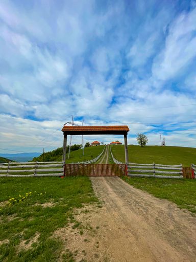 A vertical shot of the mountain house under the clouds in Serbia