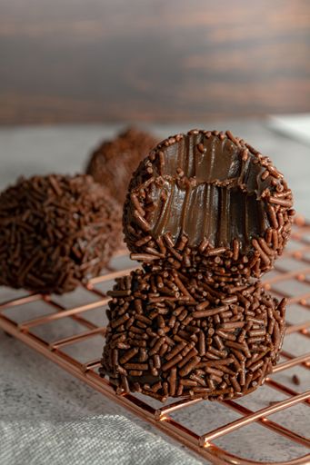 bitten Creamy Brazilian Brigadeiro, a traditional sweet from Brazil. dessert with sprinkles