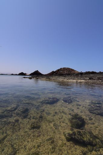 A vertical shot of the waters of Isla de Lobos - the Canary Islands in the near from Fuerteventura