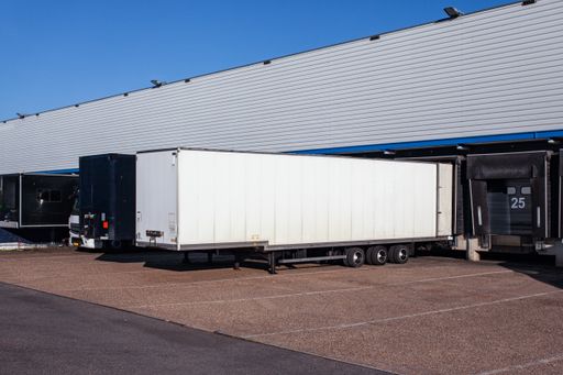 A view of trailers in front of loading doors at a warehouse