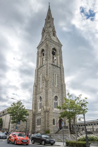 A vertical of the tower of St. Michael's Church in Dublin against a cloudy grey sky