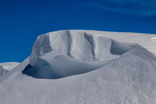 A mountain summit covered with snow in the winter
