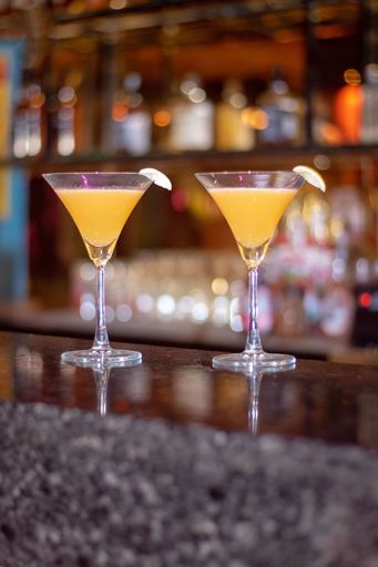 A cosmopolitan, or informally a cosmo, is a cocktail made with vodka, triple sec, cranberry juice, and freshly squeezed or sweetened lime juice.