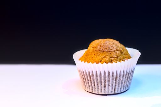 A selective focus shot of a sweet pie on the dark background