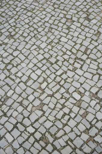 A vertical high angle shot of the floor made with bricks