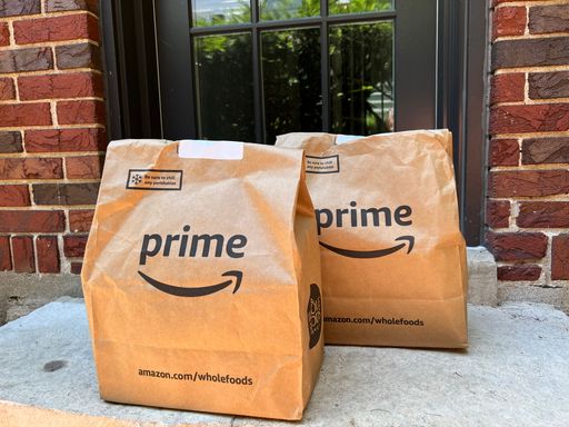 A bag full of groceries from Whole Foods Market was delivered to the doorstep by Amazon Prime