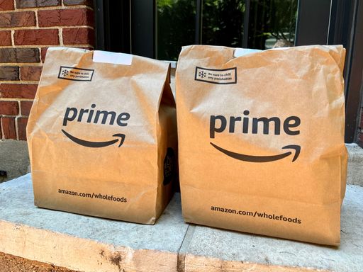 A bag full of groceries from Whole Foods Market was delivered to the doorstep by Amazon Prime