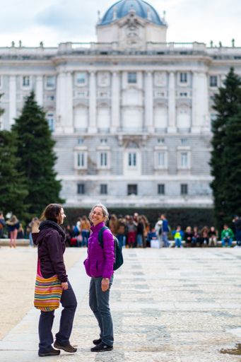 Madrid / Spain - March 24 2015: Mother and Daughter Caucasian Women Standing in a Park, Talking and Laughing each other Enjoying Their Vacations
