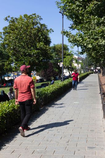 A  Two men walking opposite each other