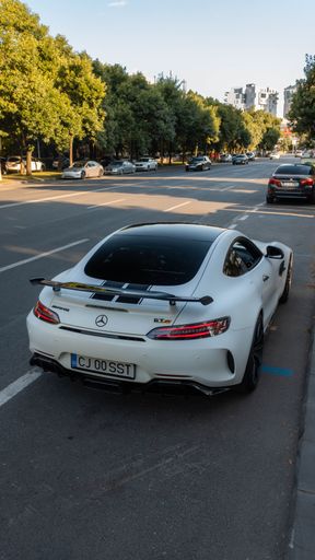 A parked vehicle situated at the side of the street