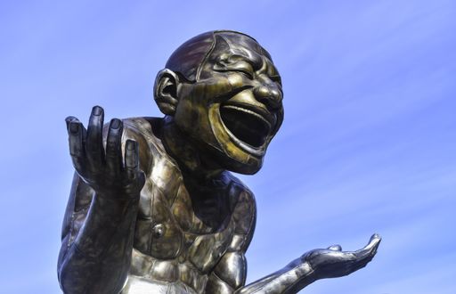 A low angle shot of A-maze-ing Laughter bronze statue in Morton Park in Vancouver, British Columbia, Canada