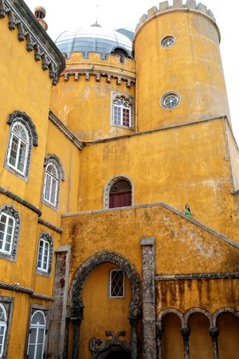 A vertical shot of the yellow building of the Pena Palace in Sintra, Portugal