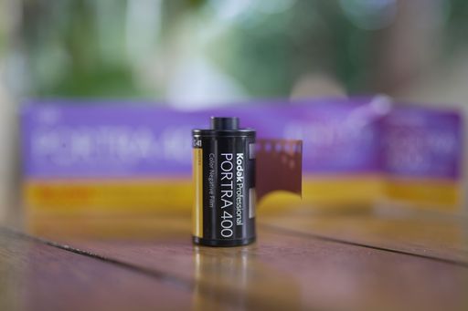 A closeup shot of Kodak Portra 400 film on wooden table