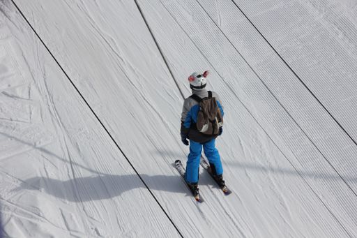 A high angle shot of a person skiing in Beaufortin near Albertville in Savoie