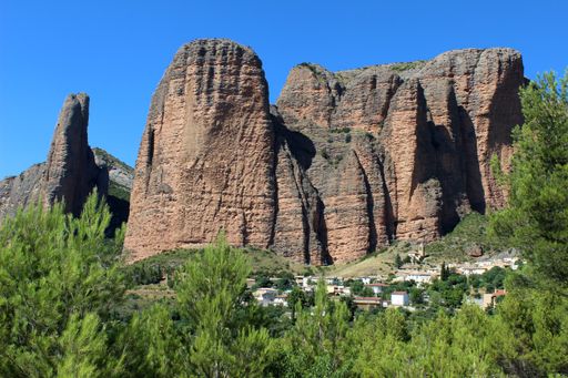 Landscape of the Mallos de Riglos (famous geological formations)  with the town of Riglos, in the province of Huesca (Aragon, Spain).