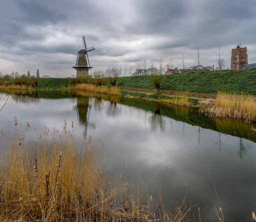 Windmill reflection near Woudrichen (NL) on a day with overcast