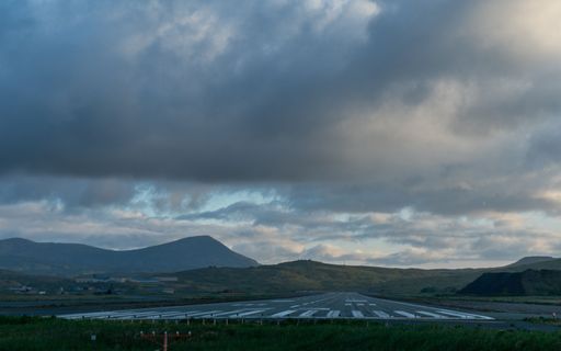 Adak's Runway 23 stretches into the twilight of Adak Island