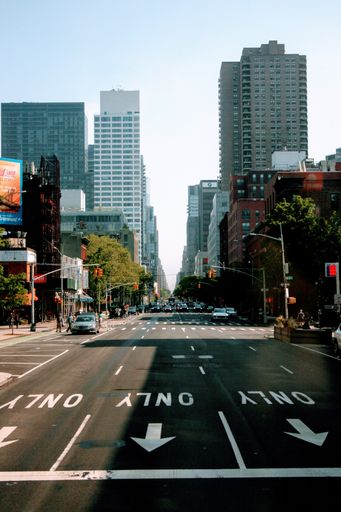 A vertical shot of modern buildings near the street in NYC, USA