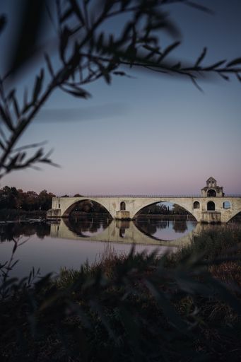A beautiful view of famous Pont Saint-Benezet bridge over Rhone River during sunset in Avignon, France