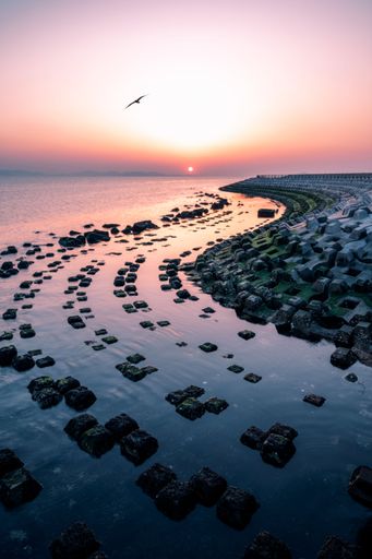 A vertical shot of Batu Bintang beach with stony squares in Indonesia during sunset