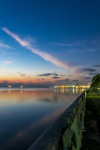 A vertical shot of a beautiful seascape at scenic bright sunset