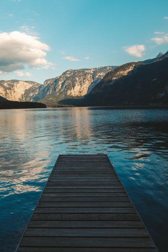 A vertical shot of a pier at a lake in Hallstatt, Austria