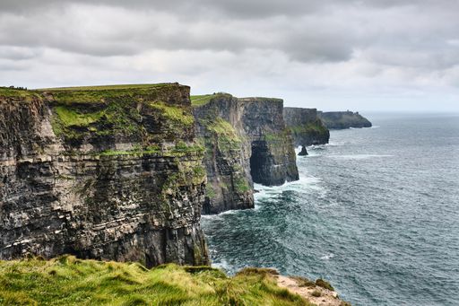 A beautiful shot of cliffs near the sea under a cloudy sky
