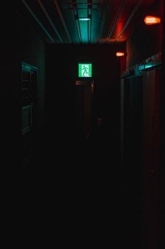 A dark moody shot of a door in a motel