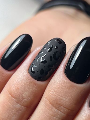 A vertical shot of a beautiful nail design on oval nails