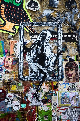 A vertical shot of beautiful graffiti art in Hackescher Markt street,  Berlin