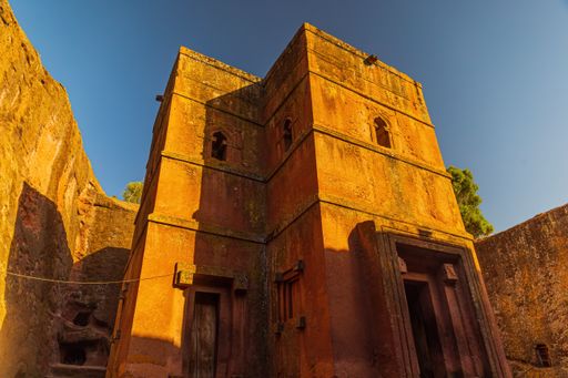 A low-angle shot of the iconic cross-shaped church of Saint George in Lalibela, Ethiopia