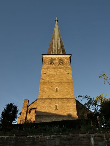 A vertical shot of St. Peter's Church in Mulheim Ruhr in warm evening sunlight