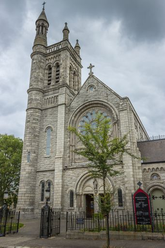A low angle shot of the Roman Catholic Church against a cloudy sky in Dublin, Ireland