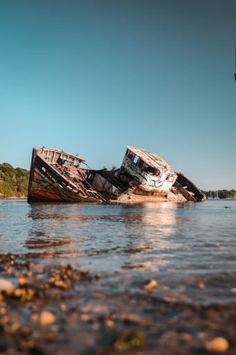 A vertical view of a ship wreck on a sunny day in Saint Malo, France