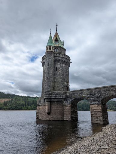 A vertical shot of the straining tower at lake Vyrnwy in the daytime, Oswestry, North Wales