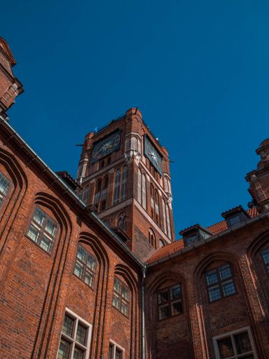 A vertical low angle shot of the Red City Hall (Rotes Rathaus) in Berlin, Germany