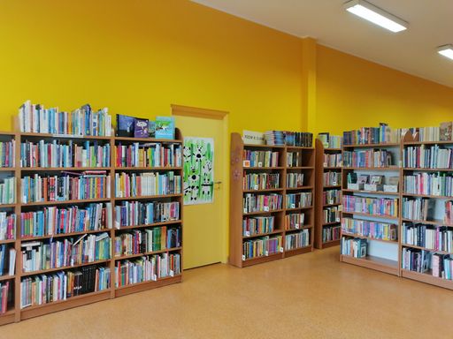 The interior of a library with bookshelves in the Rataje district.