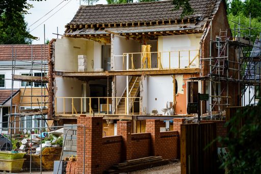 Manchester UK  25 July 2022 major renovation of house whole front walls missing showing internal rooms staircase bathroom bedrooms