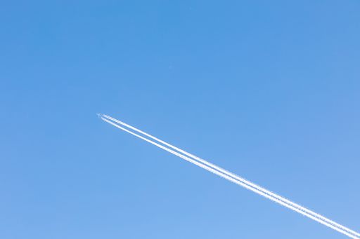 A high angle shot of aircraft vapor trail