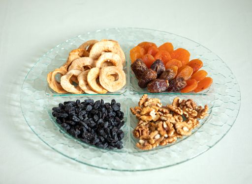 A closeup shot of a platter with dried fruits and nuts