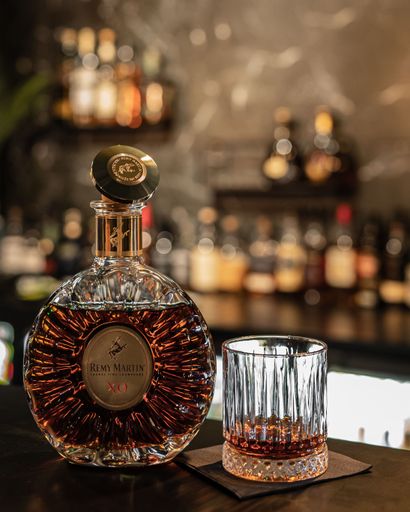 An elegant bottle of Remy Martin XO at the bar
