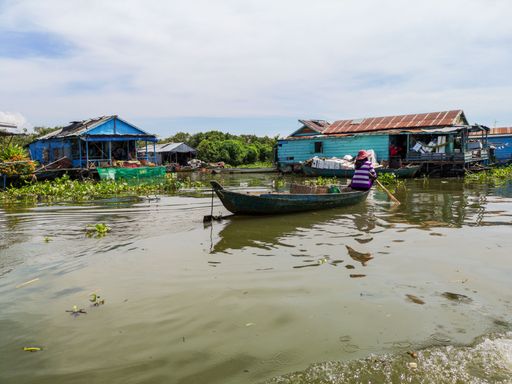A beautiful landscape of the floating village on Tonle sap lake with a boat