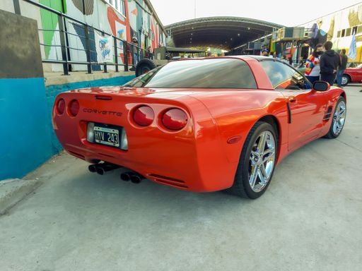 Old red and black sport Chevrolet Corvette C5 coupe two door 1997 - 2004 by GM. Classic racing muscle car. Rear view. Expo Fierro 2022. Copyspace