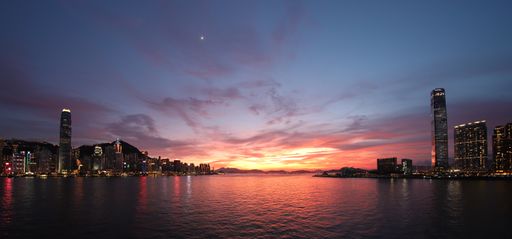 A mesmerizing shot of a coastal city at sunset - perfect for background
