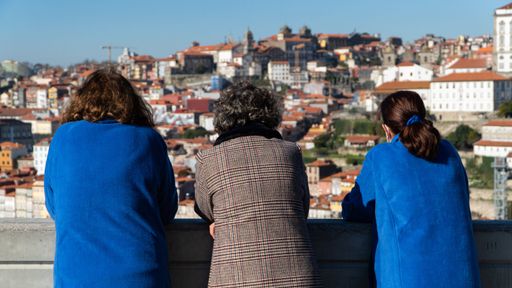 The three women looking at the city