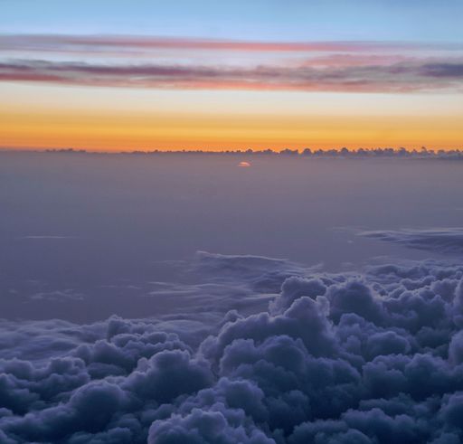 A beautiful sunset over the fluffy clouds