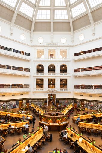The vertical high-angle view of people reading in the State Library Victoria