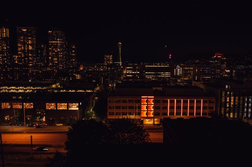 Seattle city skyline from Capitol Hill at night with crescent moon