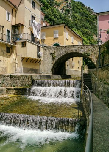 Scenic river with small waterfall crossing the town of Campagna in Salerno province, Campania region, Italy